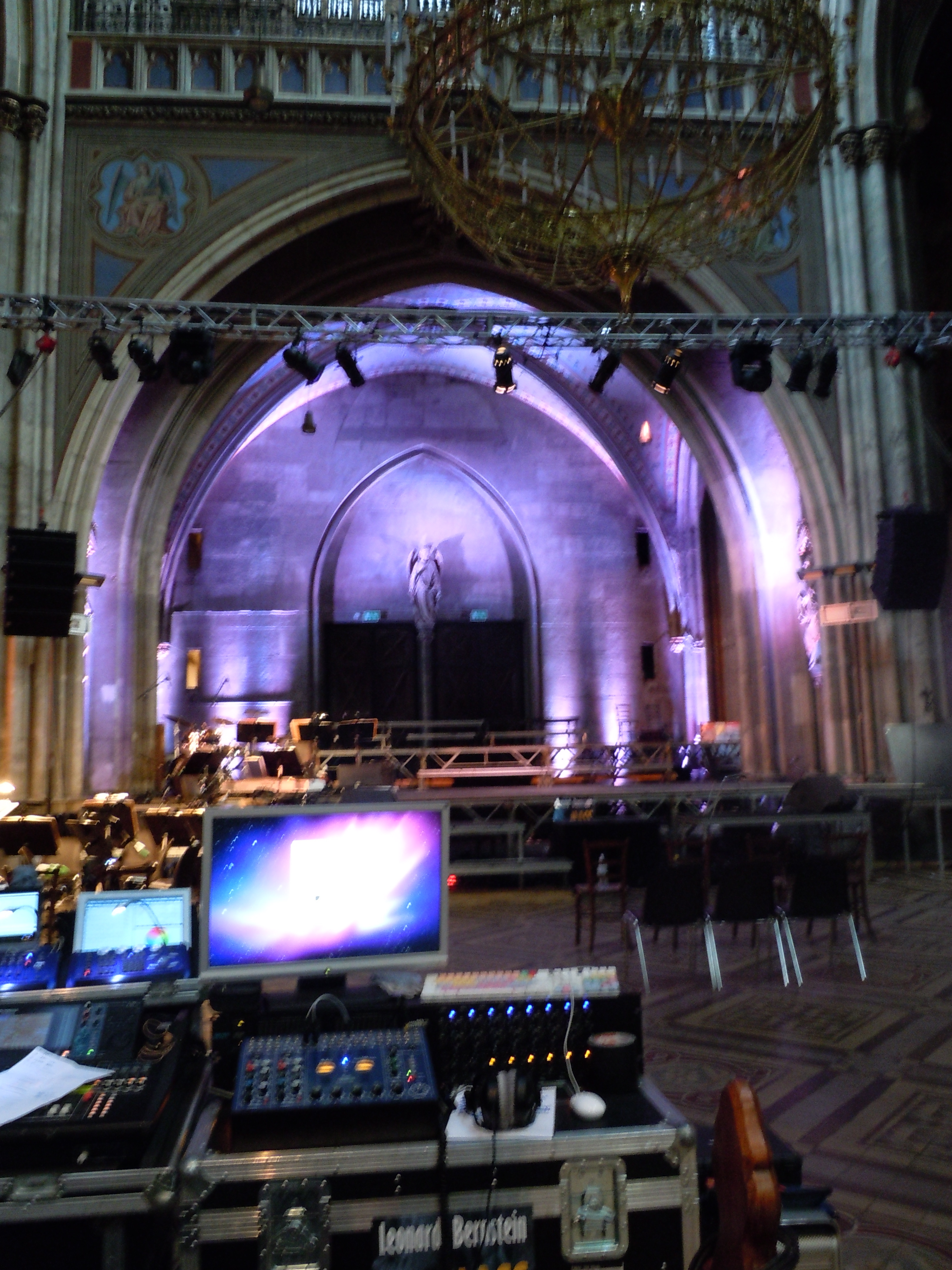 Church alcove lit up with purple lights behind imac and soundboard